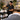 Beauty professional arranging frequently used tools and supplies within comfortable reach at an organized spa or salon workstation