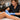 Close up of professional wax application on a client leg, highlighting safe waxing techniques on sun-kissed summer skin with soothing aloe nearby