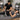Therapist safely performing stretching techniques on hypermobile client using supportive equipment on a professional massage table