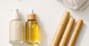 Close-up of a spa professional's hands using a smooth bamboo massage stick with glistening body oil on a client's back