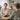 Spa owner interviewing a candidate while taking notes, with subtle red flag visual cues in the background representing problematic hiring signs