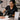 A professional spa therapist demonstrating proper portion control for products to a team member