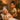 Spa professional providing facial treatment to relaxed client in luxurious salon setting