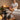 Massage therapist offering add-on treatments to relaxed client in spa setting
