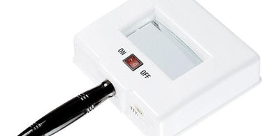 Professional using a Wood's Lamp for skincare analysis