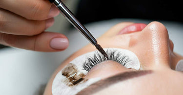 Professional lash tinting application in a spa setting