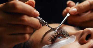 Professional applying lash extensions in a spa setting