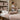 Spa linens neatly folded on a massage table, showcasing proper linen care in a professional spa setting
