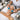 Aesthetician using cryotherapy globes on client during express facial service