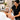 Spa professional giving a relaxing hand and arm massage to a client during a facial mask processing time to enhance relaxation and service value.