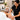 Spa professional giving a relaxing hand and arm massage to a client during a facial mask processing time to enhance relaxation and service value.