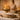 A serene spa setting with a crystal sound healing bowl and mallet placed on a soft towel next to massage oils, ready for a pre-massage relaxation ritual.