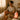 Spa therapist performing a calming facial treatment with mindfulness techniques in a serene environment