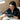 Nail technician providing manicure services in a salon