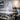 A professional massage therapist adjusts a sturdy, high-quality massage table in a serene spa setting, emphasizing the importance of understanding weight capacity for client safety and business liability.
