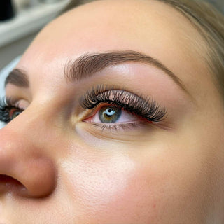 A close-up of a beautifully curled eyelash lift.