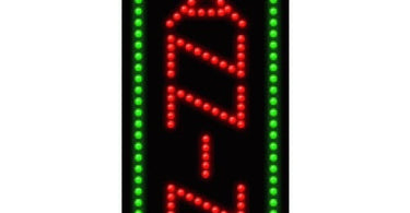 Bright LED sign for tanning salon measuring 27 inches high by 11 inches wide displaying TANNING in luminous letters on a sleek black background.