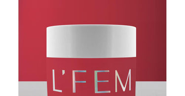 L'Fem Dip Acrylic Powder 2 oz jar in shade #007 with a high-shine finish, displayed on a salon table.