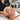 Esthetician applying finishing facial products with a gentle patting motion to prevent product pilling on client's skin