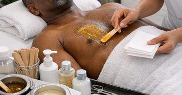 Efficient service flow in a busy wax-only boutique featuring esthetician preparing wax warmer and supplies