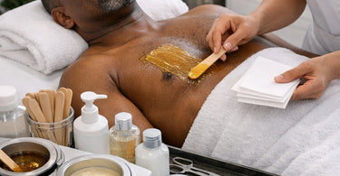 Efficient service flow in a busy wax-only boutique featuring esthetician preparing wax warmer and supplies