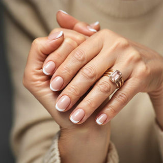 Mature hands showing trendy manicure for clients over 60 with elegant nail polish colors