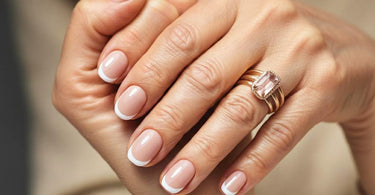 Mature hands showing trendy manicure for clients over 60 with elegant nail polish colors