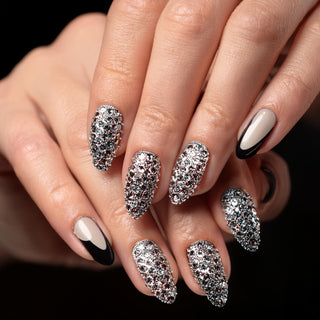 Manicure with Rhinestones, showing a close-up of nails decorated with various rhinestone patterns.