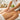 A therapist's hands performing a soothing massage on a client's back in a serene spa setting, symbolizing the healing connection between therapeutic touch and internal wellness.