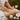 Pure Spa Direct's luxurious massage coconut oil bottle with tropical coconut background