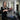 Stylist perming gray hair in a salon