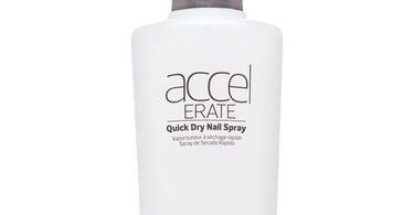 Morgan Taylor Essentials Accelerate Quick Dry Spray bottle on a clean salon table with polished nails in the background