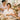 Spa professional preparing a luxurious Mother's Day pampering package featuring nail care, massage tools, and premium waxing supplies from Pure Spa Direct