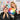 A hairstylist consulting with a client about hair color maintenance, with vibrant color swatches and professional products visible.