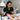 Nail technician assessing a client's hands with open cuts before a manicure