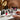Assorted high-quality nail art supplies including polishes, brushes, and embellishments.