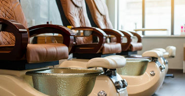 Luxurious nail salon pedicure chairs arranged for client comfort.