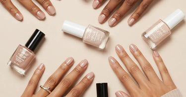 Professional nude nail polish shades displayed on a salon table