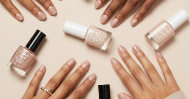 Professional nude nail polish shades displayed on a salon table