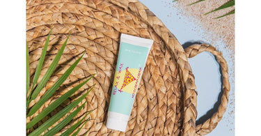 Relax & Wax No Scream Cream bottle with waxing supplies on spa table