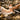 Pedicure add-on menu display with products for callus care, paraffin wax, foot mask, and massage, set in a professional spa.