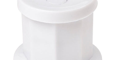 Close-up of a clear plastic dappen dish on a clean spa workstation, showcasing its simple and functional design.