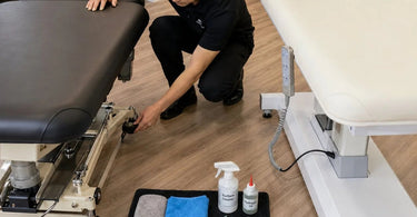 Comparison of hydraulic and electric lift massage table maintenance with tools and cleaning supplies