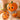 June Jacobs Perfect Pumpkin Peeling Enzyme Masque jar surrounded by fresh pumpkins and autumn leaves