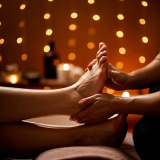 Client receiving a relaxing foot reflexology massage