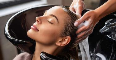 Client enjoying a relaxing hair wash in a salon.