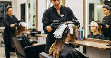 Salon Client Getting Hair Color Treatment