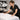 Esthetician using magnifying lamp with proper diopter setting for professional skin analysis in spa treatment room