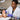 Professional applying AHA foot peel treatment with booties in a spa setting.