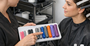 Assorted colorful cold wave perm rods demonstrating different diameters for professional salon spiral curls and body waves.